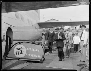 Passenger embarking on the Tasman Empire Airways Ltd Solent seaplane Aotearoa II ZK-AML, Mechanics Bay, Auckland