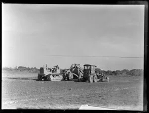 Men working with heavy machinery to make extensions for Harewood Airport, Christchurch