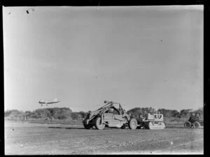 Men working with heavy machinery to make extensions to Harewood Airport, Christchurch