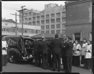 The coffin being placed into the hearse during the funeral for Brother Hippolyte, Auckland