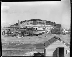Tasman Empire Airways Ltd Solent seaplane RMA Ararangi undergoing inspection outside the hangar, Mechanics Bay, Auckland