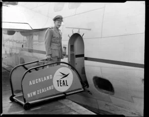 Captain Griffiths, Tasman Empire Airways Ltd, boarding the seaplane