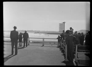 Group of people watching the seaplane leaving, Mechanics Bay, Auckland