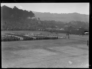 Reception at the Domain, Auckland, for the Duke and Duchess of York, with throng forming a Union Jack on a parade ground