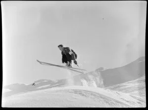 Skier doing a ski jump on Coronet Peak, Otago