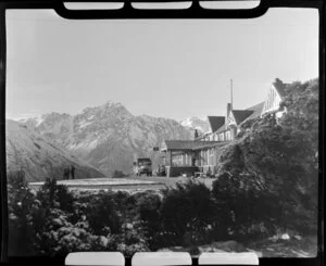 Mt Cook and Southern Lakes Tourist Company Ltd bus at The Hermitage Hotel, including Mt Cook in the background