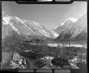 Mt Cook and Southern Lakes Tourist Company Ltd Bus, including Mt Cook in the background