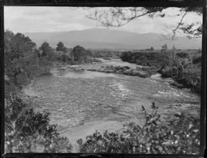 Unidentified river with trout fishermen