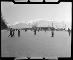 Ice skaters at Lake Tekapo, South Canterbury, including Mt Cook in the background