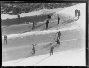 Unidentified men curling on a frozen river, Otago Region