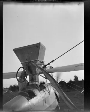 Hopper being placed in the aircraft; Auckland Aviation Services aerial topdressing, Clevedon