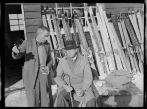 Two unidentified men, outside ski hut, Coronet Peak Ski Field, Central Otago