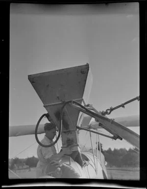 Loading the aircraft from the hopper; Auckland Aviation Services aerial topdressing, Clevedon