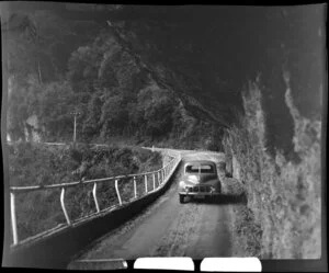 Morris Minor on the road below Hawks Crag, Buller River