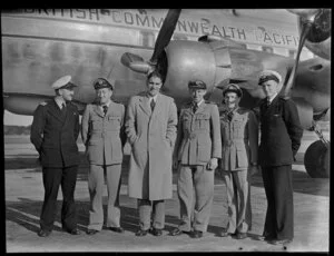 Captain Burgess with officers of Natioanl Airways Corporation and British Commonwealth Pacific Airlines beside the aircraft RMA Endeavour at Whenuapai