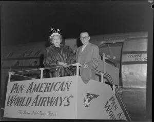Unidentified man and woman at entrance to Pan American World Airways aircraft Clipper Monsoon