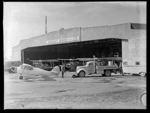 Aircraft and truck outside the hangar of Aircraft Service (NZ) Ltd, Auckland