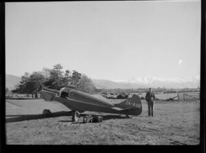 Harry Wigley beside a Miles Whitney Straight aircraft, Timaru