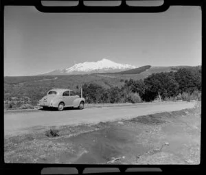 Morris Minor on the Desert Road with Mount Ruapehu in the background