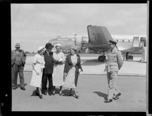 Prime Minister Sidney Holland arriving at Whenuapai Airport, Auckland, including his family