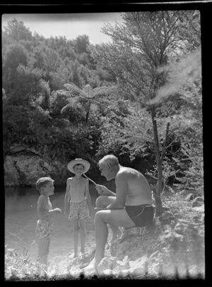 River scene, grandfather talking with grandsons, Whitianga, Coromandel Peninsula