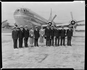 Pan American World Airways, crew members standing in front of the Stratocruiser aircraft at Whenuapai Airbase, Auckland