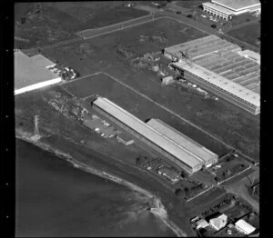 Unidentified factories in industrial area, Manukau City, Auckland, including tidal inlet