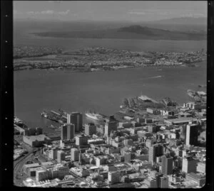 View over Auckland City buildings and wharves towards Devonport and Rangitoto Island