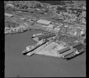 Containers and ships at the Port of Auckland, Waitemata Harbour, including industrial area and Auckland Railway Station