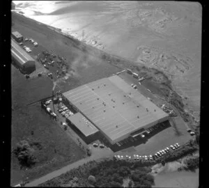 Unidentified factory in industrial area, Manukau City, Auckland, including tidal inlet