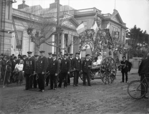Members of the Wanganui Volunteer Fire Brigade, probably during a procession to celebrate the coronation of George V