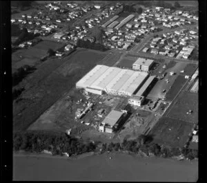 Unidentified factory in industrial area, Manukau City, Auckland, also including residential housing and tidal inlet