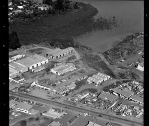 Unidentified factories and commerical buildings and lots, including car yards, car wreckers, and tyre and furniture shops, in Manurewa-Papakura area, Auckland, also including mangroves
