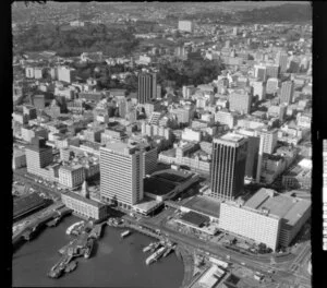 Auckland city waterfront area with shipping and tall buildings