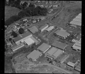 Unidentified factories in industrial area, Auckland, including quarry and wooded area