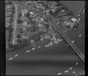 Bridge (Lagoon Drive) across Tamaki River, Pakuranga, Auckland, including boats moored at jetty