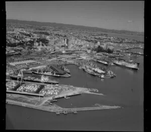 Ships, containers and cranes at Port of Auckland, Waitemata Harbour, including Auckland City and Railway Station