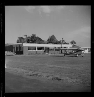Mangere, Auckland Aero Club buildings and airstrip, including an aeroplane