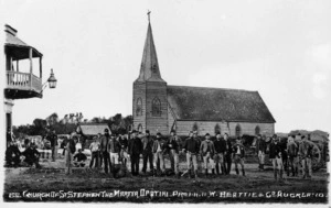 Row of soldiers in Opotiki in front of the church later known as Saint Stephen the Martyr - Photograph taken by William Beattie and Company
