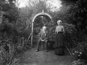 Henry Arden seated in a garden