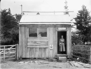 Postmistress, Miss Sophie Mathews, at the door of the Kaitaia Post Office