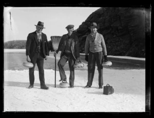 Three unidentified men curling