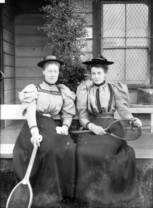 L Mackorras and Bessie Scott holding tennis rackets