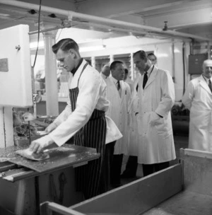 Duke of Edinburgh observing cuts of meat being processed, Gear Meat Works, Petone