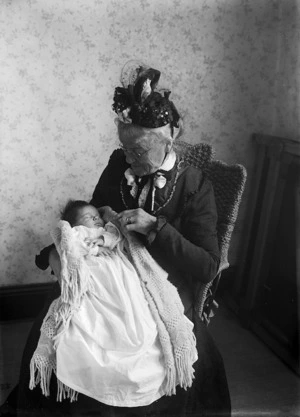 Elderly woman holding a baby