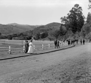 Men and women strolling along Main Road, Akaroa