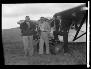 Three unidentified men with aircraft