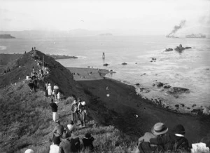 Crowd at Point Dorset, Seatoun, watching the floating dock being pulled in to Wellington