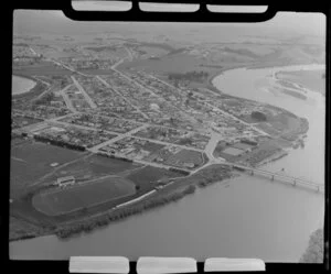 Balclutha, Otago District, showing Milton Highway (State Highway 1) with bridge over Clutha River to township with sports grounds and primary school, farmland beyond