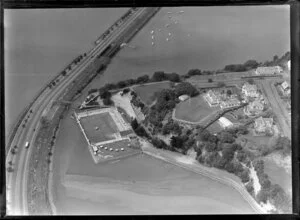 Close-up view of Parnell Baths, Auckland City, showing Point Resolution Park, Tamaki Drive and railway, Judges Bay with Albert Park House (Albert Barracks) and residential housing, Hobson Bay beyond